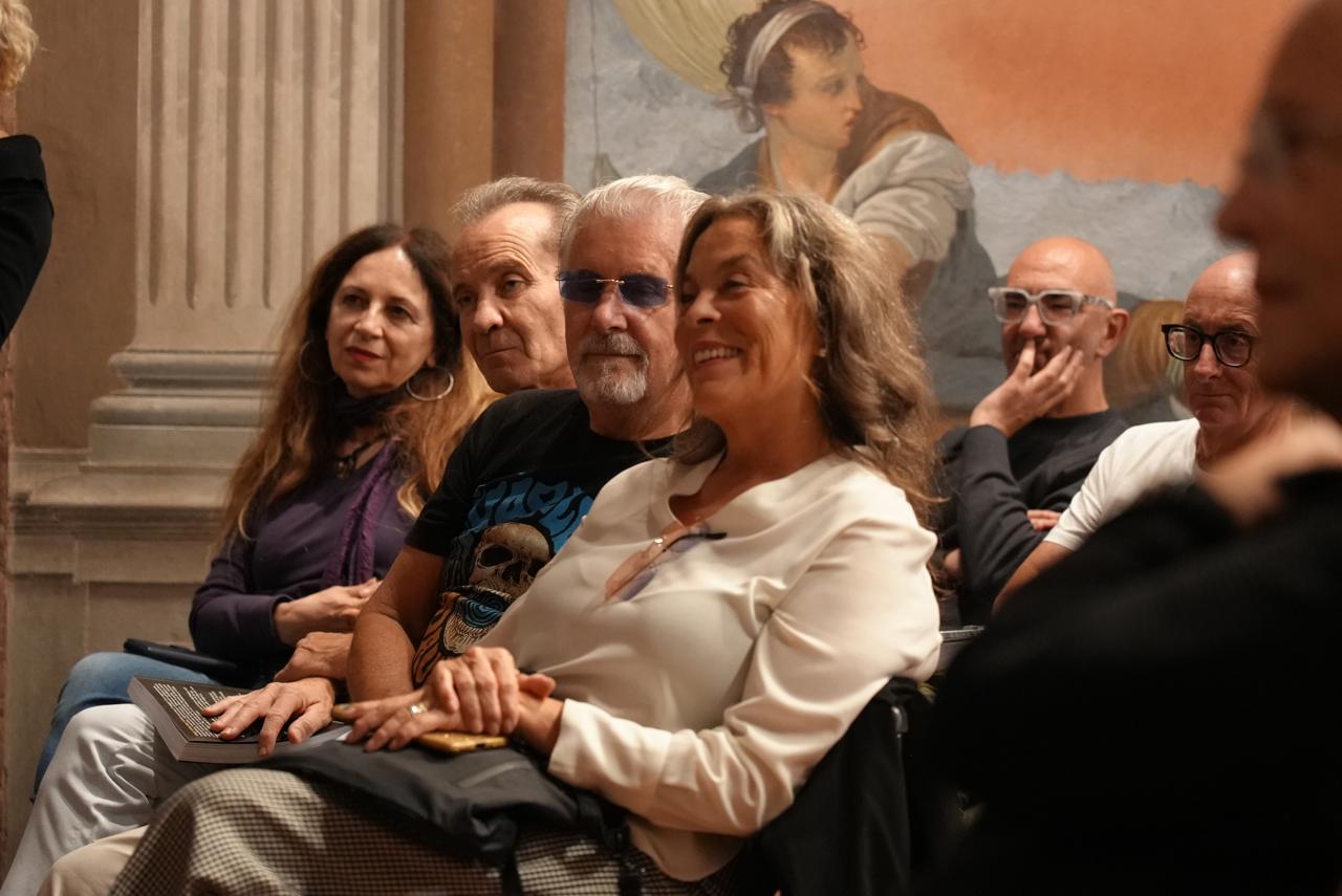 Audience members laughing together