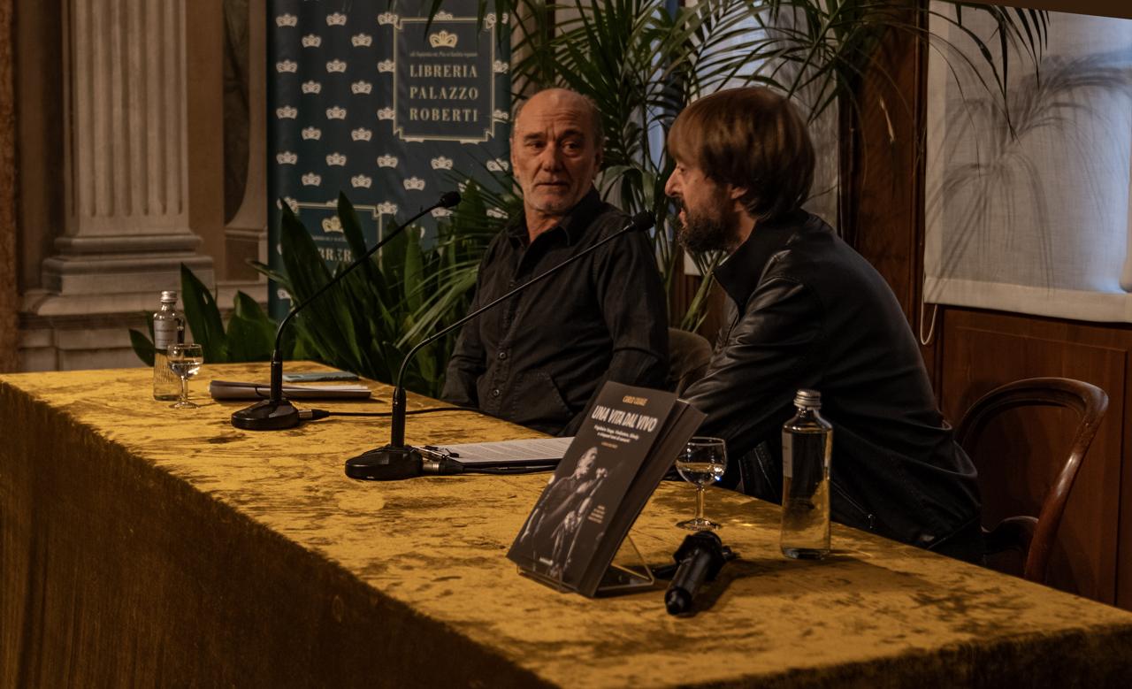 The table at Palazzo Roberti with the book standing between the microphones